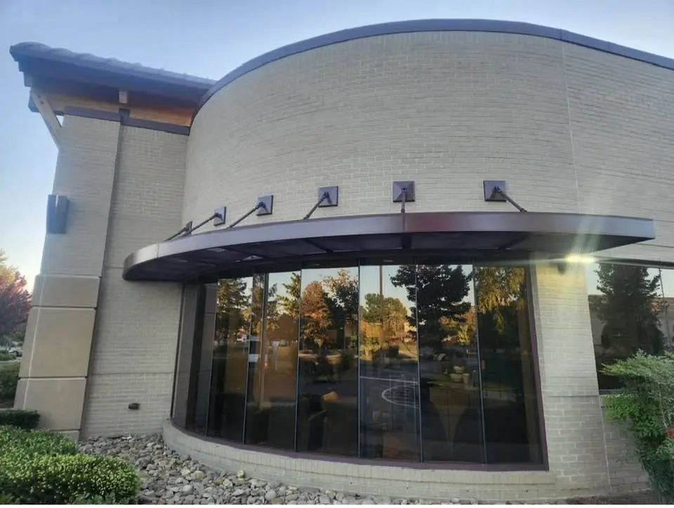 Curved Storefront Window System and Bronze Awning